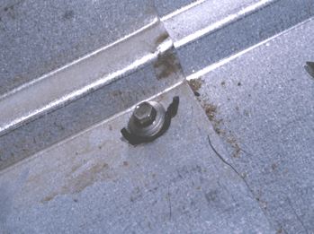 over-compressed screw failed fasteners on metal roof