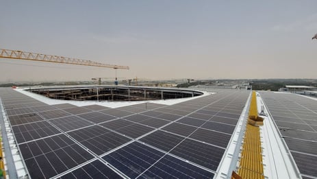 Large commercial rooftop solar array installed on a metal roof using a standing seam solar mounting system.