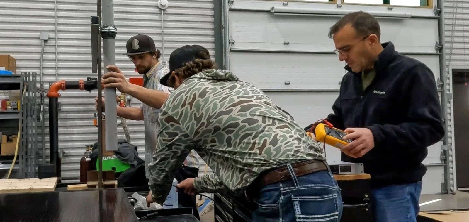 Technicians conducting laboratory testing to verify UL 3741 compliance for solar mounting systems.