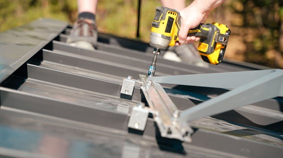 engineered mounting solution for utility attachments being installed on a standing seam metal roof