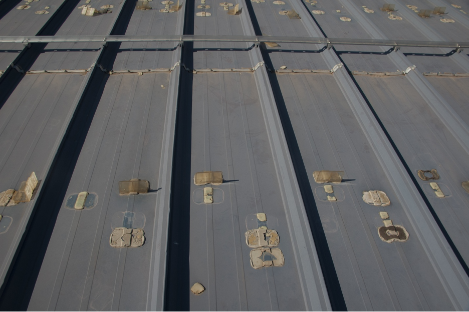 Plastic cleats left unsightly glue marks on the roof after failing